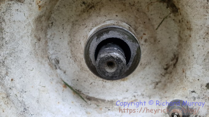 The mower's wheel, after years of use and years of wanting grease.