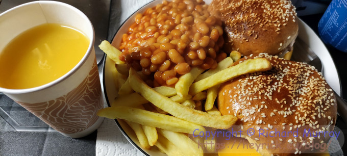Chicken burgers, chips, and beans