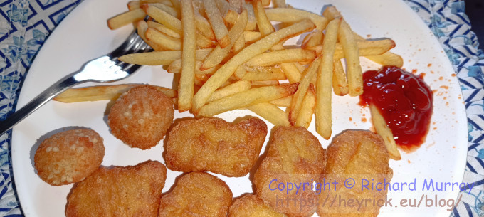 Chips and nuggets on a plate