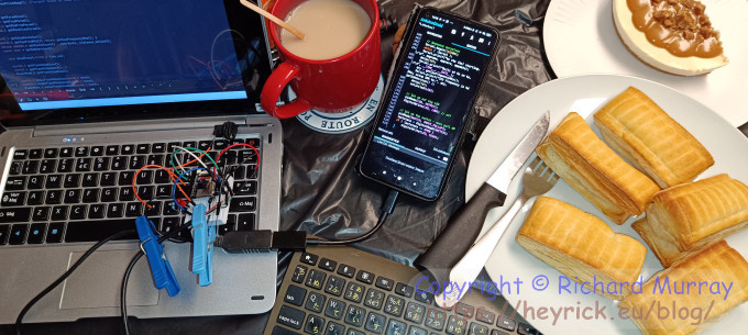 Tech stuff all over the kitchen table.