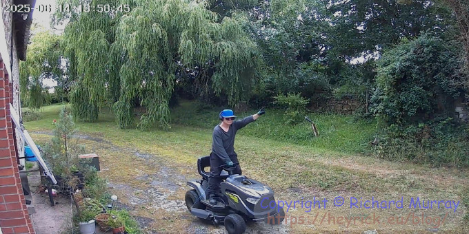 Me riding a ride-on mower.
