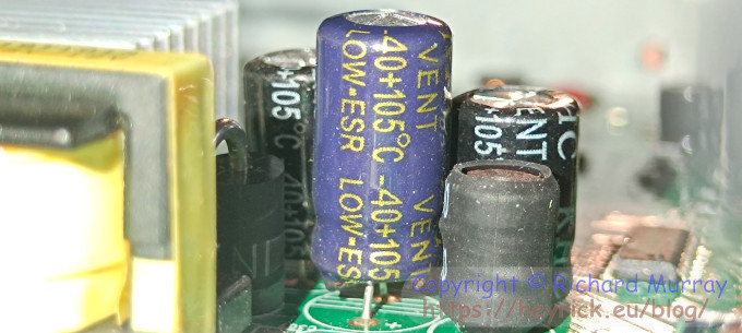 A photo of capacitors on a circuit board.