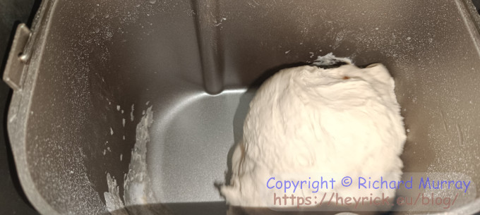 A bread maker kneading dough.
