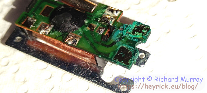 Corroded contacts on the circuit board.