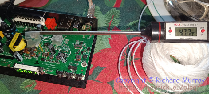 A temperature probe on a hot capacitor.