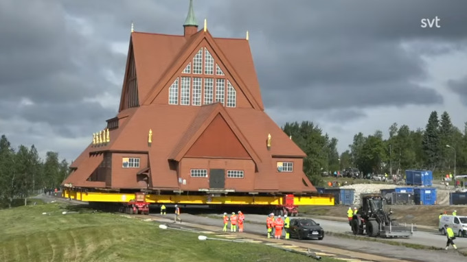 A screenshot of a church being moved.