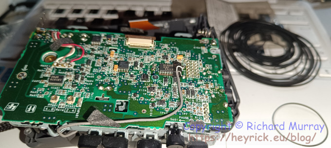 A photo of the inside of a cassette recorder.