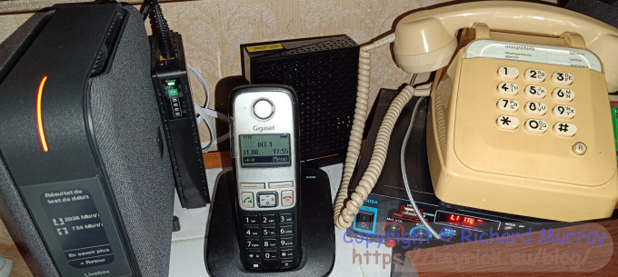 A photo of the Livebox and my two phones.
