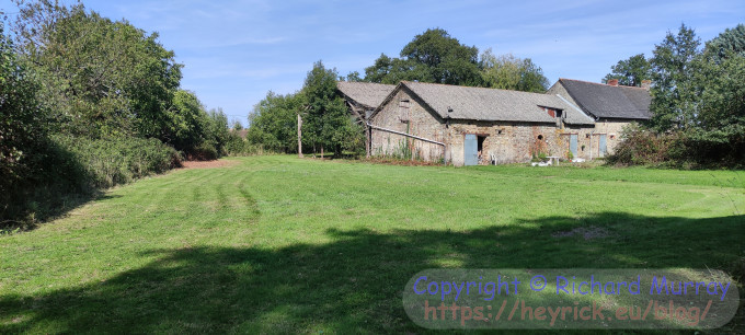 A picture of grass being mown.