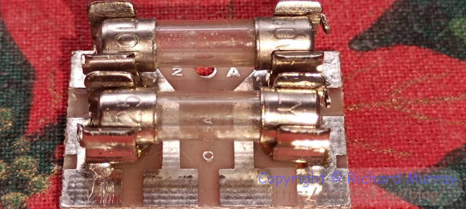 Blown fuses on a carrier board.