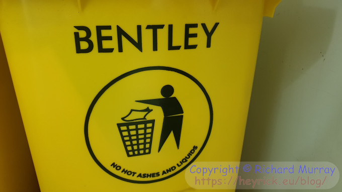 A photo of bad grammar on a yellow plastic bin.