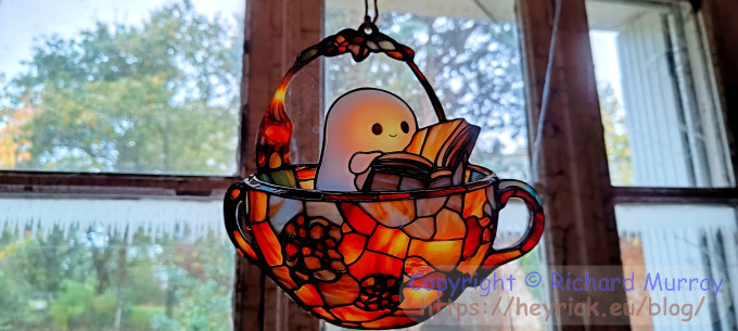 Cute ghost reading a book