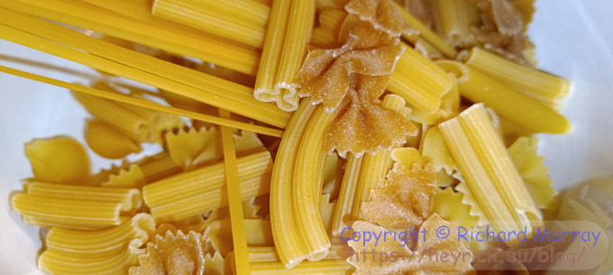 Raw uncooked pasta pieces.