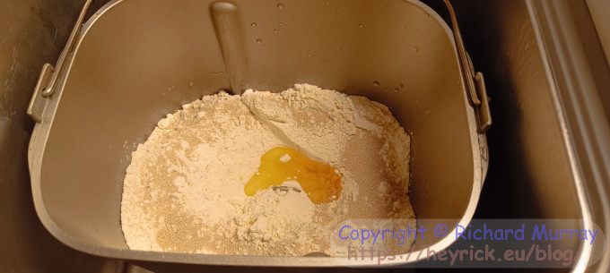 The ingredients to make bread, in the breadmaker.