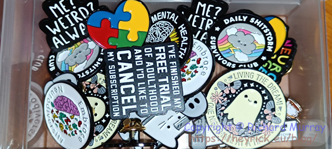 A box of pin badges.