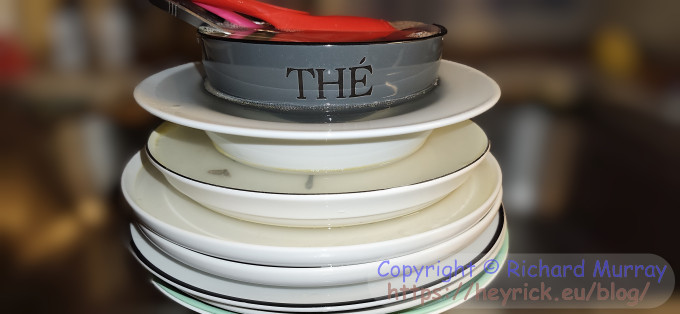 A pile of dishes to be washed.