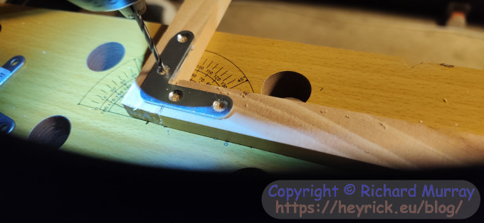 Drilling screw holes.